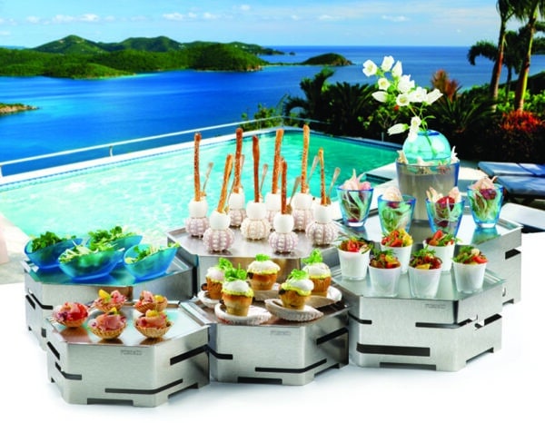 woman on a Caribbean vacation enjoying a tropical cocktail in a pool