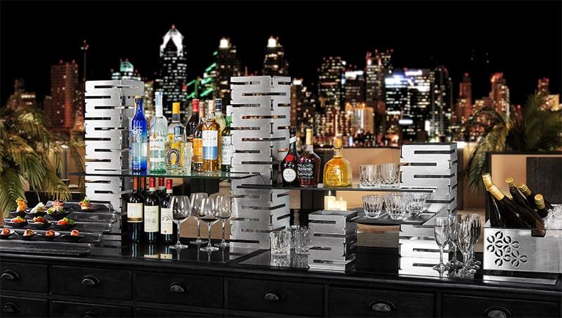 Skycap bar setup with a city skyline